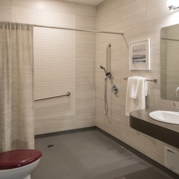 Ensuite accessible bathrooms provide ample space for caregivers and easy access showers